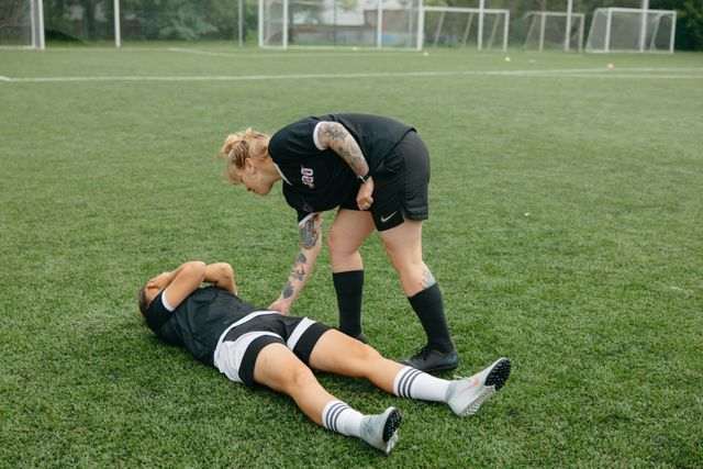 An athlete lying on ground
