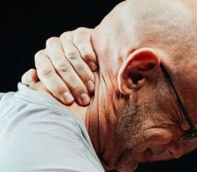Senior man experiencing neck soreness and muscle stiffness